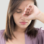 a woman experiencing dry eye symptoms