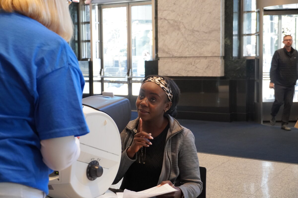 A vision screening participant asks a question. A vision screening participant asks a question.