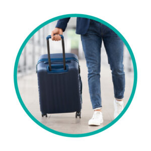 a person pulling carry-on luggage